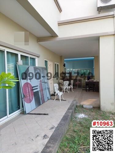 Spacious patio area with dining set and large sliding doors