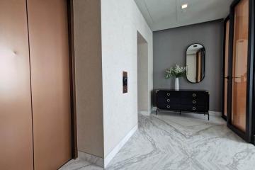 Modern entrance hallway with marble floors and elegant decor