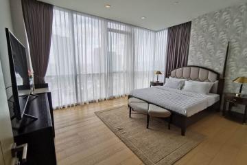 Modern bedroom with ample natural light and stylish decor