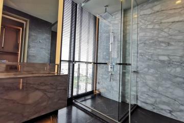 Modern bathroom with marble finish and large window