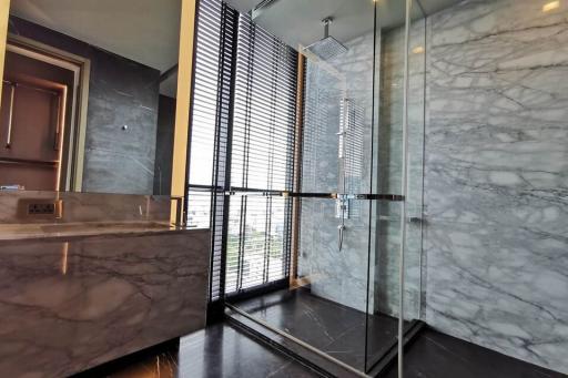 Modern bathroom with marble finish and large window