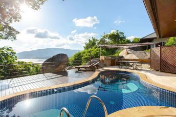 Luxurious private pool with breathtaking scenic view and sunny skies