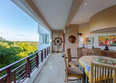 Spacious balcony with dining area and panoramic views