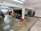 Spacious indoor storage or parking area with concrete flooring