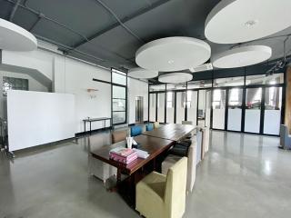 Spacious office interior with modern lighting and furniture