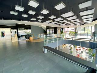 Modern building lobby with artistic ceiling and glass balustrades