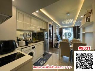Modern kitchen with integrated appliances and dining area