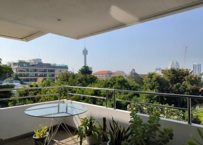 Spacious balcony overlooking the city with ample sunlight