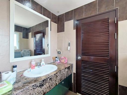 Modern bathroom interior with large mirror and vanity
