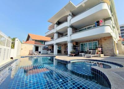 Exterior view of a multi-level house with swimming pool