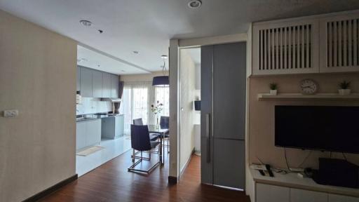 Open concept living room with integrated kitchenette