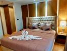 Spacious and well-appointed bedroom with comfortable king-sized bed and modern wooden furniture