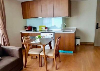 Compact kitchen with dining area and modern appliances