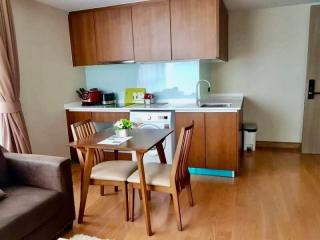 Compact kitchen with dining area and modern appliances