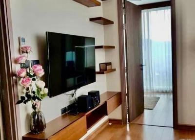 Modern living room with wall-mounted shelves and television