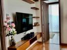 Modern living room with wall-mounted shelves and television