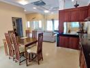 Spacious open plan living area with kitchen, dining, and lounge