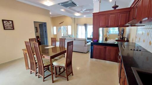 Spacious open plan living area with kitchen, dining, and lounge