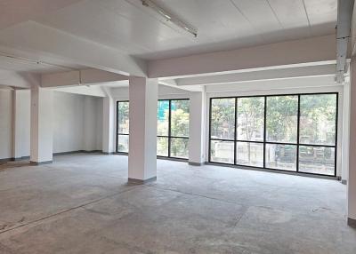 Spacious empty interior of a building with large windows