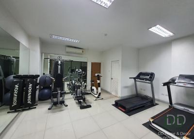 Spacious home gym with a variety of fitness equipment