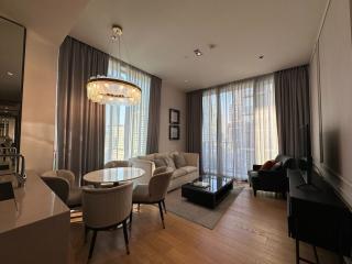 Modern living room with ample natural light and contemporary furniture