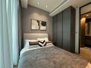 Modern bedroom with a cozy double bed, elegant wall art, and sophisticated interior design