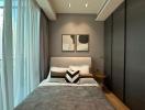 Modern bedroom with a comfortable bed, stylish decor, and ample lighting