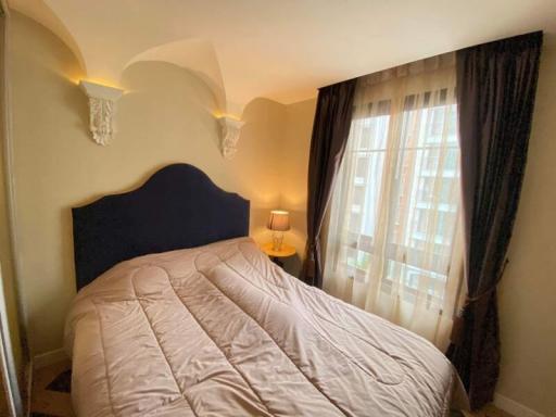 Cozy bedroom interior with large window and elegant decor