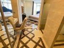 Spacious and modern bedroom with en-suite bathroom and geometric floor tiles