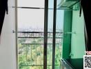 View from a high-rise building window overlooking the city