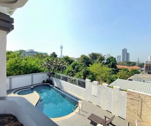 Spacious balcony with a private pool and a city view