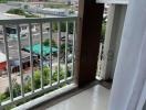 Balcony view with air conditioning unit and urban background