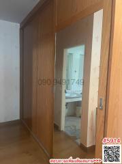 Corridor view leading to a bathroom inside a home