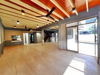 Spacious living room with high ceiling and modern design