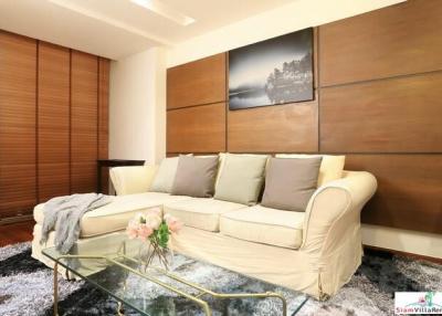 Convenient and Comfortable Two Bedroom Condo for Rent with Lots of Wood Accents in Lumphini