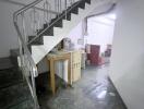 Modern staircase in a residential home with tiled flooring