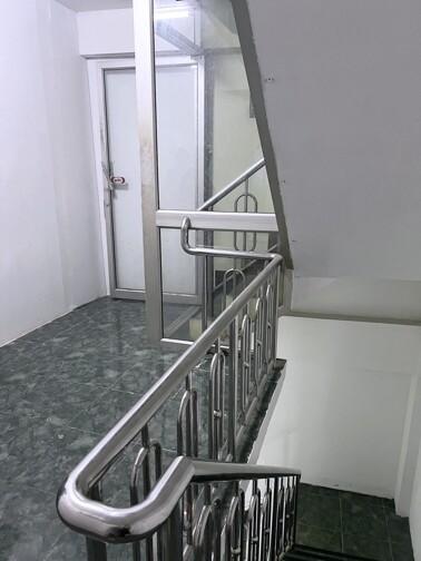 Modern staircase with metal railing in a residence