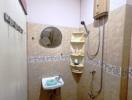 Compact tiled bathroom with sink, mirror, shower, and water heater