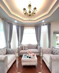 Elegant living room with classic furniture and sophisticated ceiling design