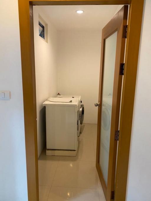 Compact laundry room with washing machine and dryer