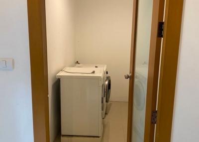Compact laundry room with washing machine and dryer