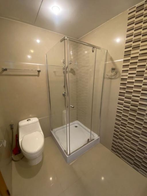 Modern bathroom with shower cabin and toilet