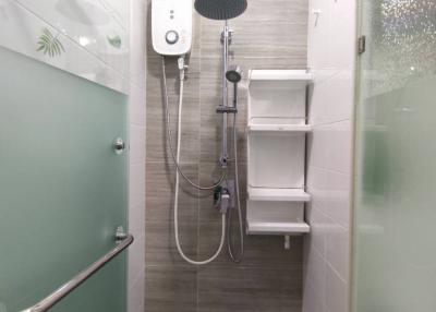 Modern bathroom with walk-in shower and glass door