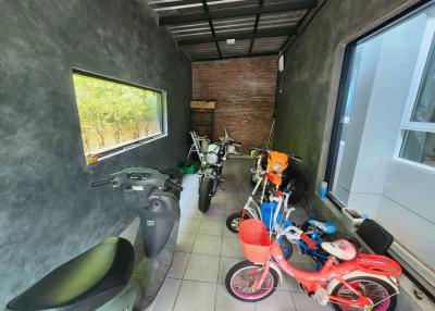 Spacious garage with motorcycles and bicycles