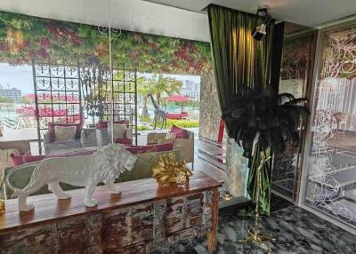 Eclectic living room with distinctive decor and access to a balcony