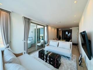 Modern living room with natural light and balcony access