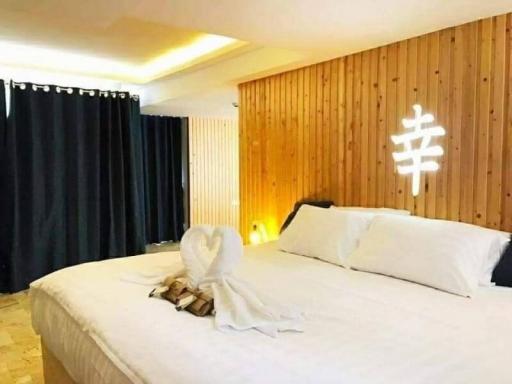 Cozy bedroom with modern wooden wall design and ambient lighting