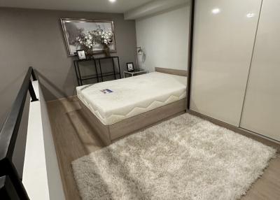Modern bedroom with large bed and ample storage