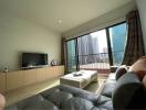 Modern living room interior with large windows and city view