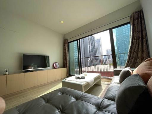 Modern living room interior with large windows and city view